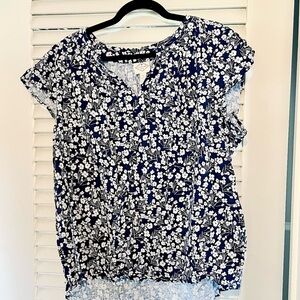 Navy and white floral blouse.